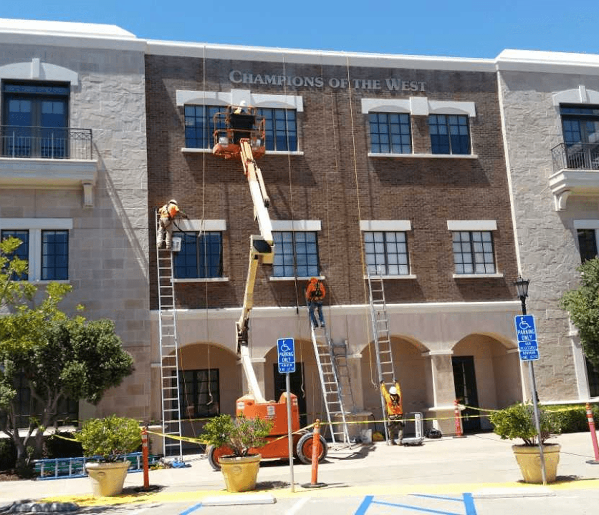 Construction crew working on building exterior