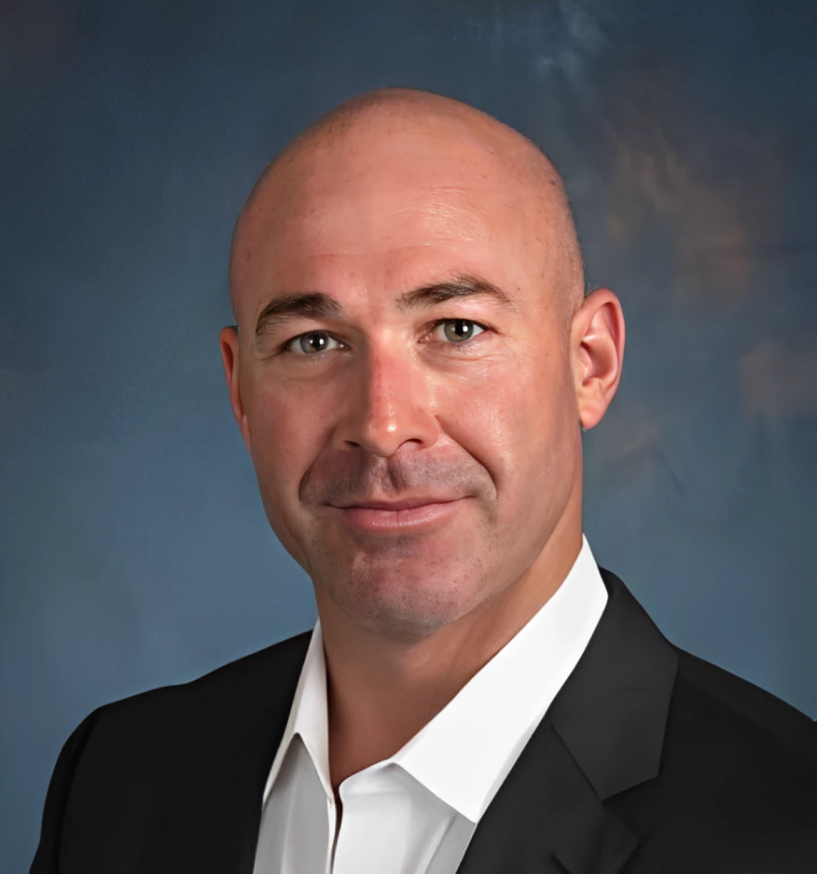 Professional headshot with blue background
