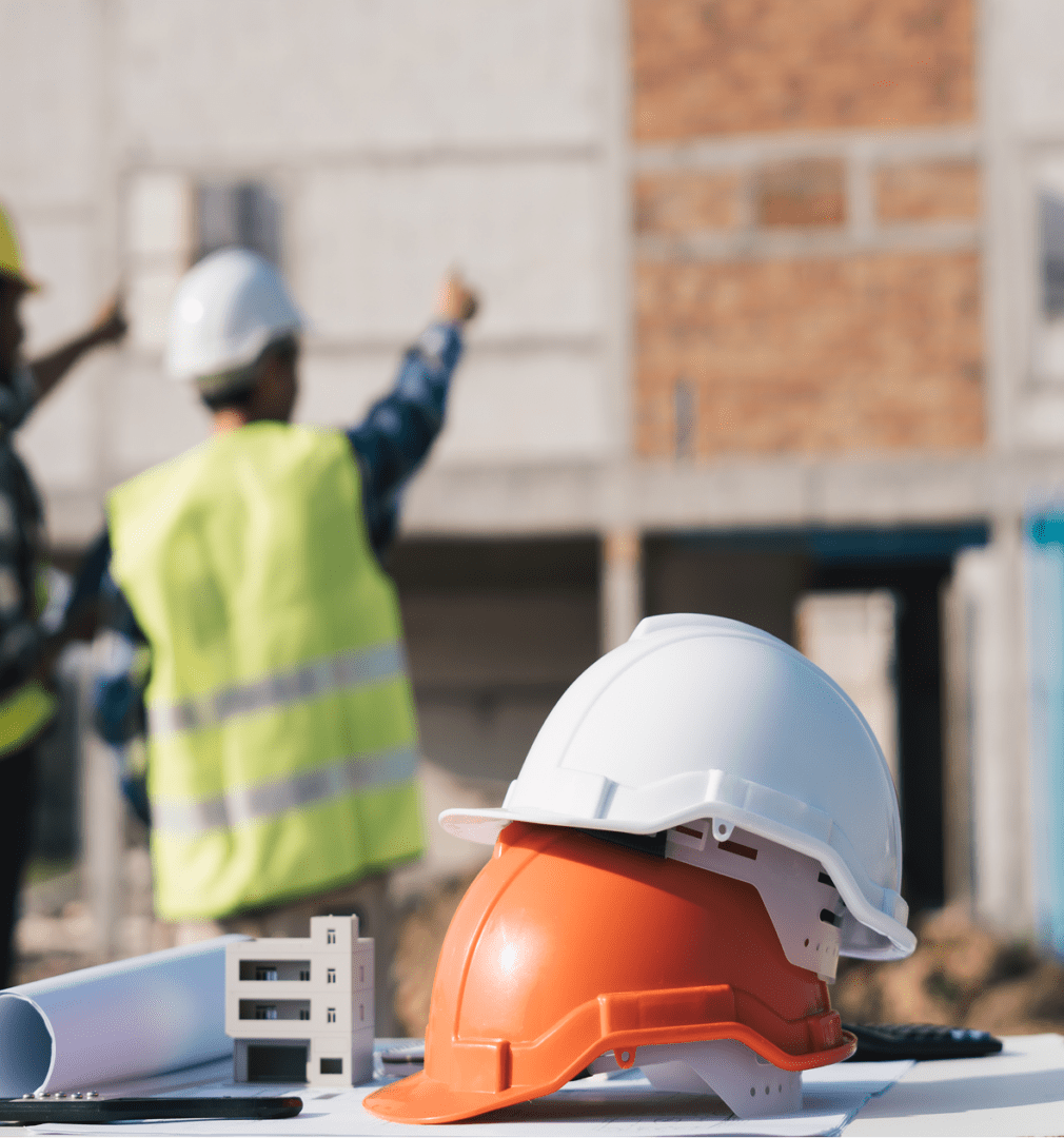 Workers discussing building plans
